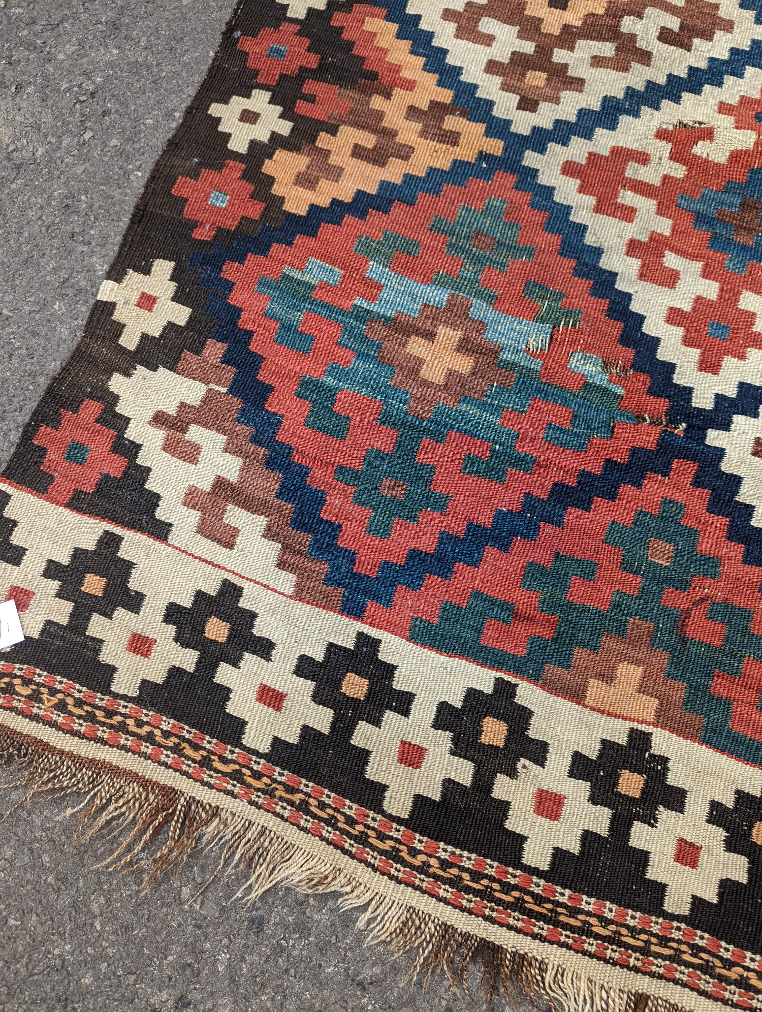 A Persian tribal Kelim carpet, 230 x 158cm and a Turkish bag